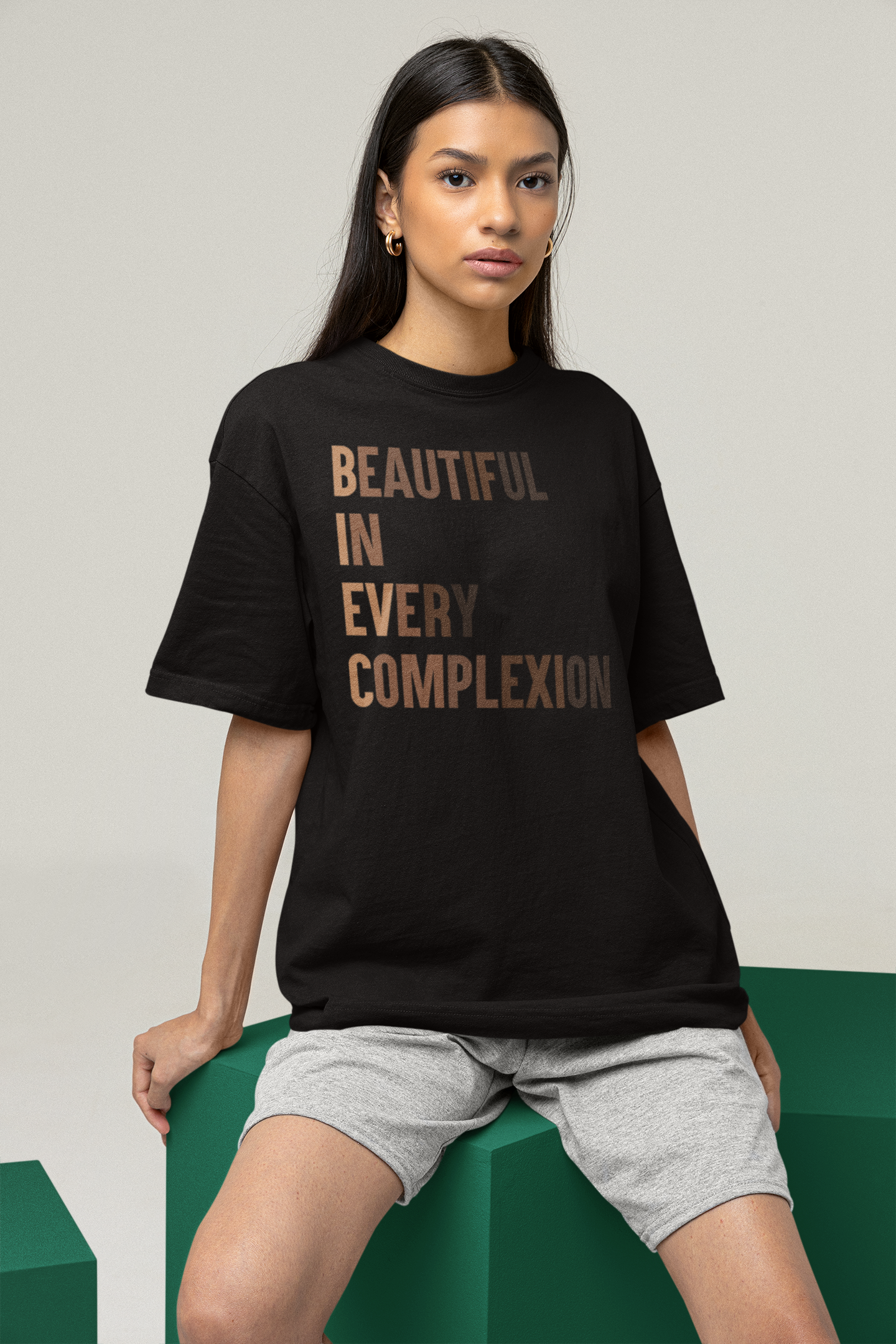 A beautiful lady wearing the unisex high-quality 100% cotton fabric black t-shirt with phrase " BEAUTIFUL IN EVERY COMPLEXION" 