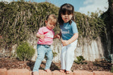 Kids Blessed Shirt in Pink and Blue: a light pink t-shirt for kids featuring the word 'Blessed'. The shirt has short sleeves and a round neckline